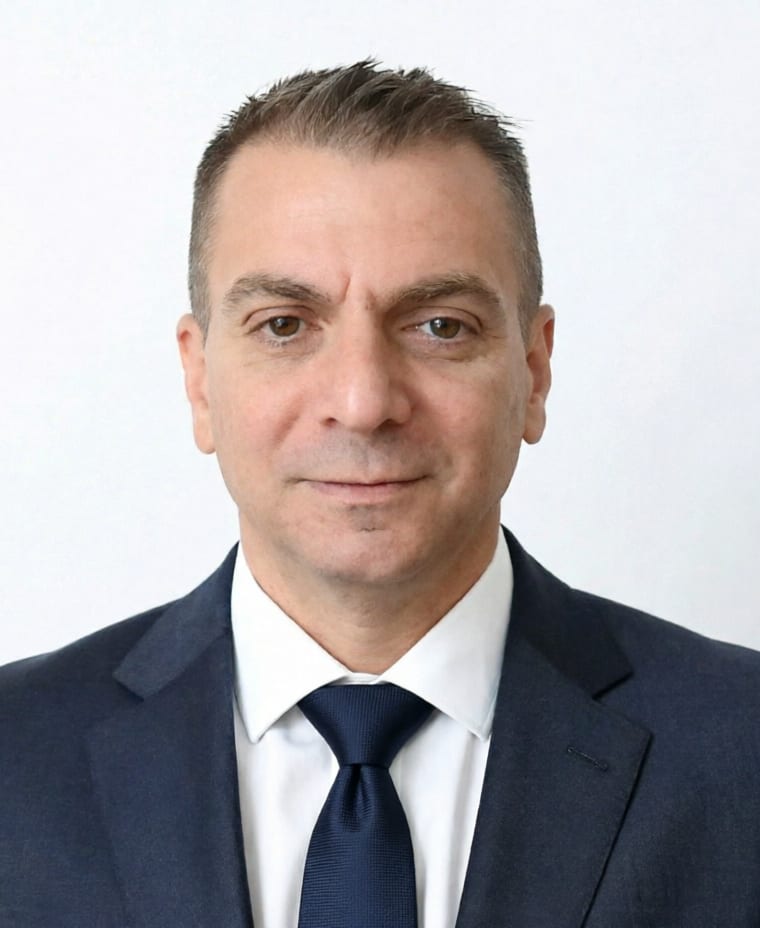 Anthony Vela, founder of Anthony Vela Financial, in a navy suit